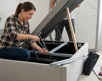 Fitting a replacement gas strut onto an ottoman bed frame